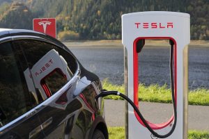 Tesla power station Tesla black car charging at a Tesla power station