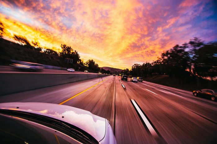 Photo of a road seen from the top of a car