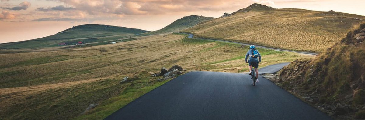 Photo of a road without cars and a cyclist
