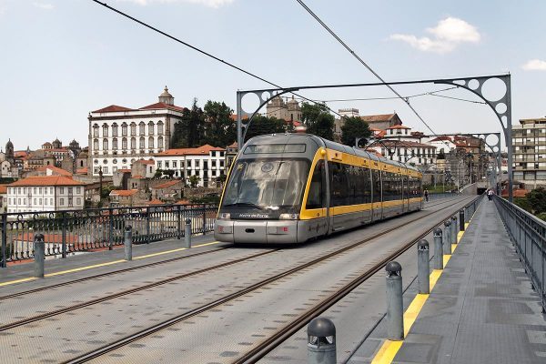 A Porto metro car as it travels through the city over the Luis I bridge