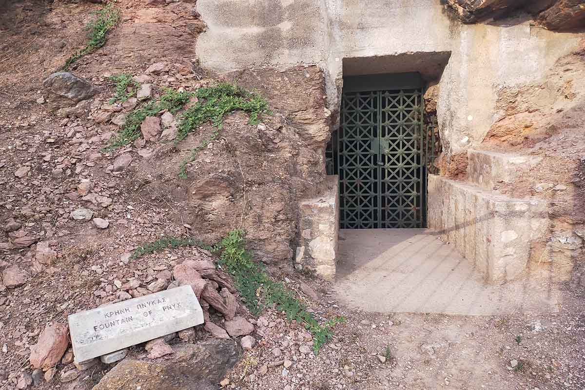 Fountain carved into the rock at the foot of the Acropolis