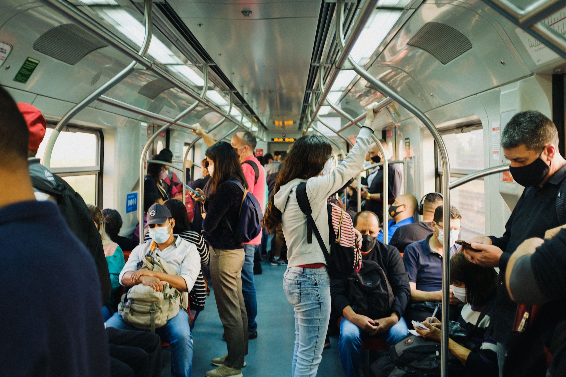 People with face masks on public transportation