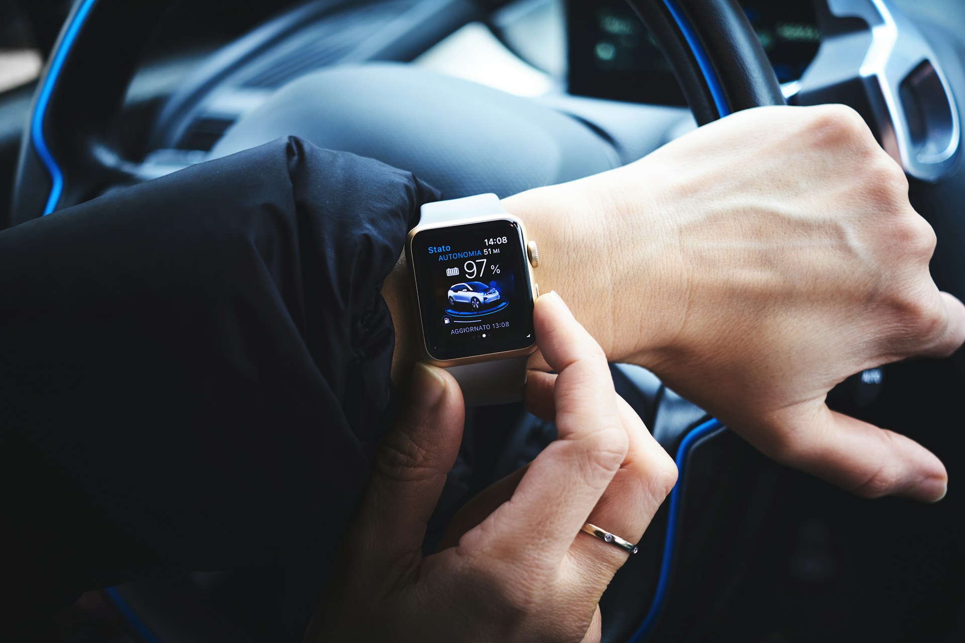 A person setting a destination for their car on their smartwatch.